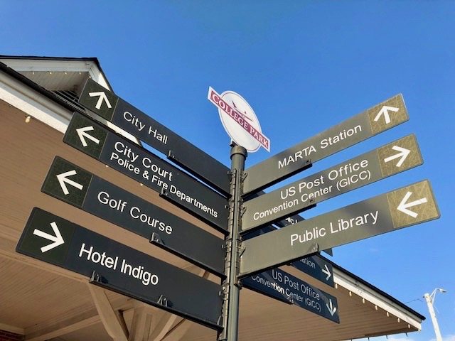 College Park wayfinding signpost — City Hall, MARTA, GICC, Golf Course, Hotel Indigo
